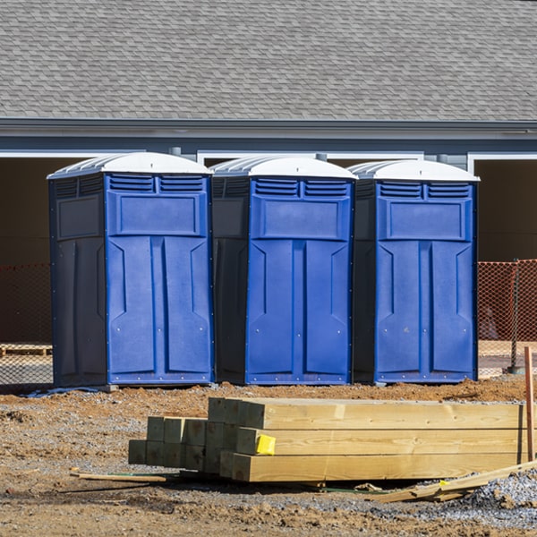 what is the cost difference between standard and deluxe portable restroom rentals in Onekama